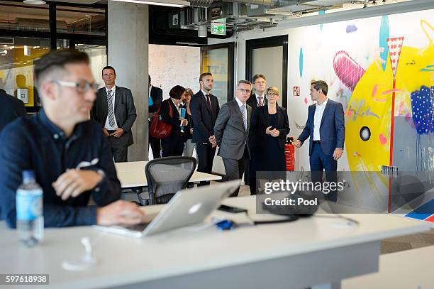 German Interior Minister Thomas de Maiziere tours the Berlin office of Facebook on August 29, 2016 in Berlin, Germany. The German government has put...