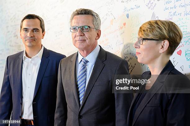 German Interior Minister Thomas de Maiziere tours the Berlin office of Facebook on August 29, 2016 in Berlin, Germany. The German government has put...