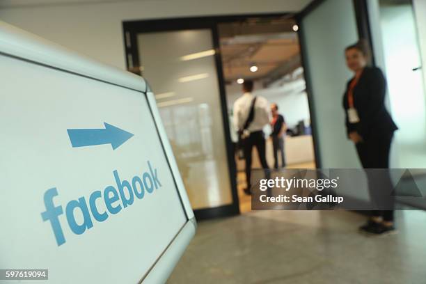 Sign points to the Berlin Facebook offices on the day German Interior Minister Thomas de Maiziere toured the facility and held talks with Facebook...