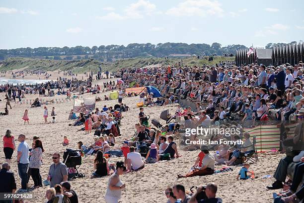 Thousands of spectators line the seafront and beach to watch the North Sea Tall Ships Parade of Sail on August 29, 2016 in Blyth, England. The...