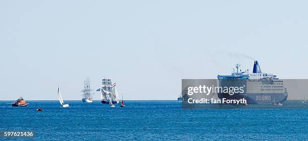 The North Sea Tall Ships Parade of Sail make their way past a DFDS Seaways ferry on August 29, 2016 in Blyth, England. The bustling port town in...