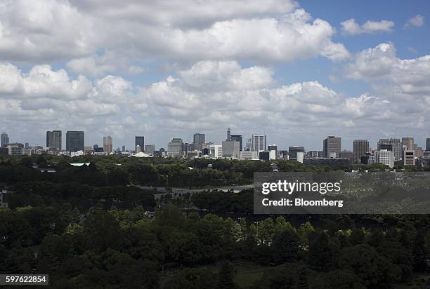 Commercial buildings are seen from a window in the Imperial Lounge Aqua bar at the Imperial Hotel in Tokyo, Japan, on Friday, Aug. 19, 2016. Tokyo's...