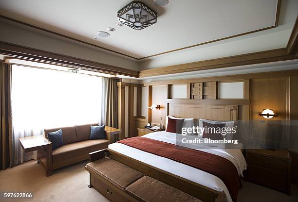 Couch and a bed are seen in the Frank Lloyd Wright suite at the Imperial Hotel in Tokyo, Japan, on Friday, Aug. 19, 2016. Tokyo's Imperial Hotel, the...