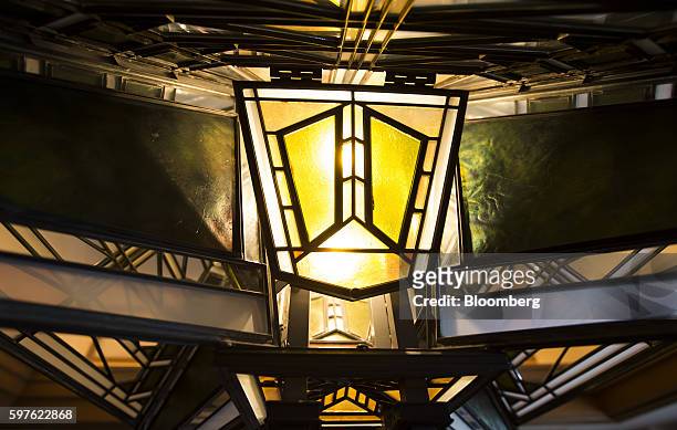 Stained glass light fixture is seen inside the dining room of the Frank Lloyd Wright suite at the Imperial Hotel in Tokyo, Japan, on Friday, Aug. 19,...