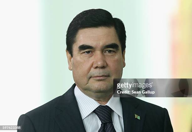 Turkmenistan President Gurbanguly Berdymukhamedov arrives to speak to the media with German Chancellor Angela Merkel following talks at the...