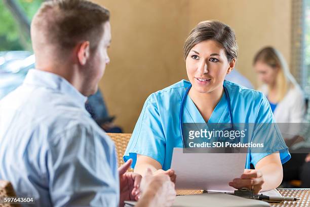 manager of hospital nursing staff interviewing potential healthcare employee - interview event stock pictures, royalty-free photos & images