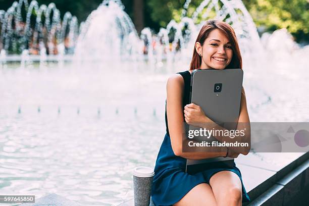 holding a large smart phone - big hug stock pictures, royalty-free photos & images