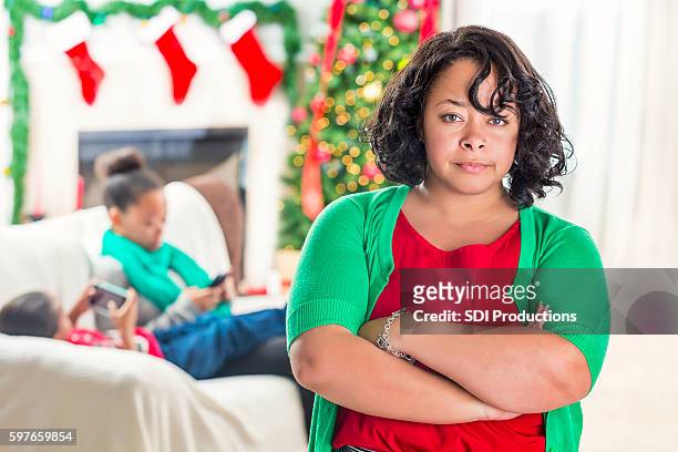 mom is upset with children's use of technology at christmastime - annoying brother stock pictures, royalty-free photos & images