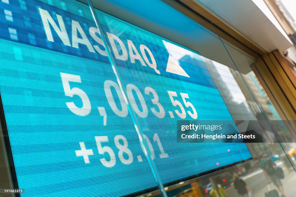 Stock market data screen in window, New York, USA