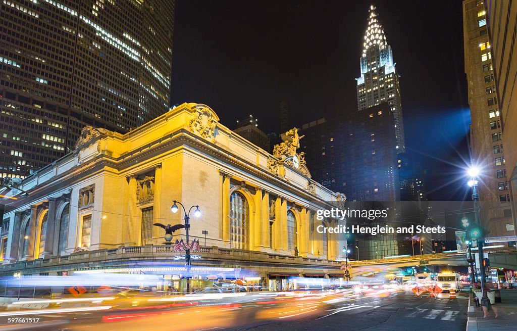 Busy traffic and Grand Central Station at night, New York, USA