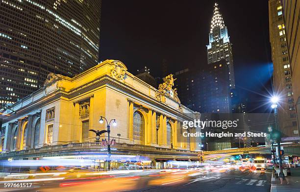 busy traffic and grand central station at night, new york, usa - grand central station manhattan stock pictures, royalty-free photos & images