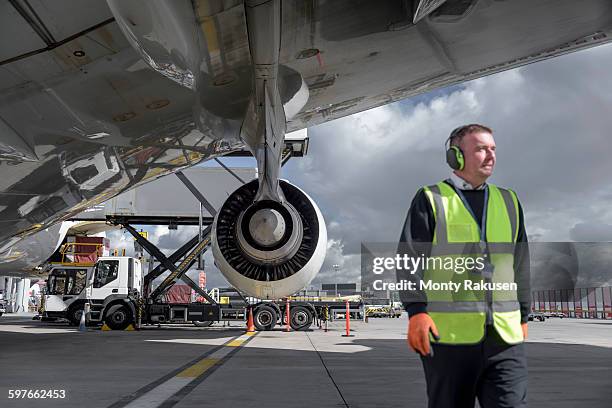 ground crew engineer with a380 jet aircraft - airport worker stock pictures, royalty-free photos & images