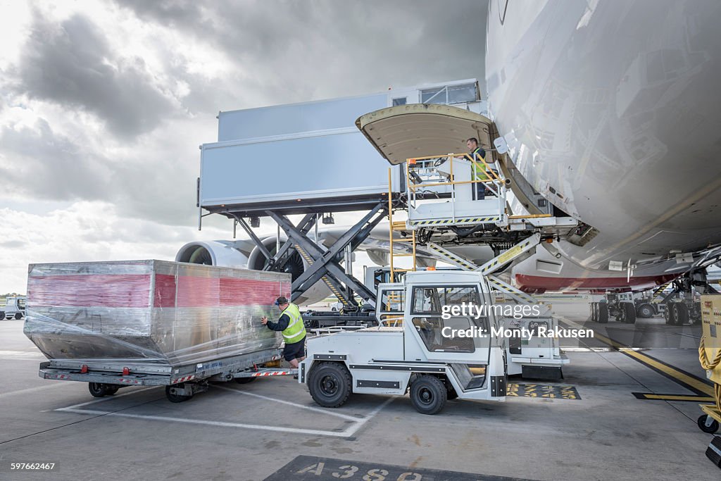 Ground crew loading freight into A380 aircraft