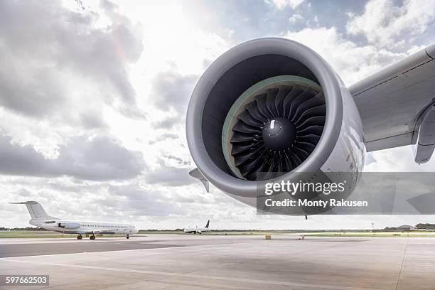 view of a380 aircraft jet engine and planes on runway - jet engine - fotografias e filmes do acervo