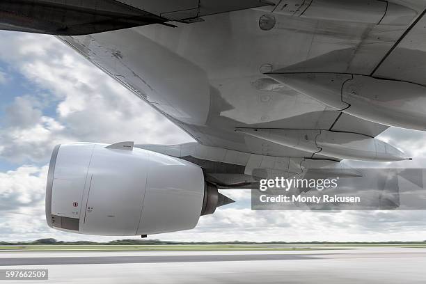 view of engine and wing on speeding a380 aircraft - jet engine stock-fotos und bilder