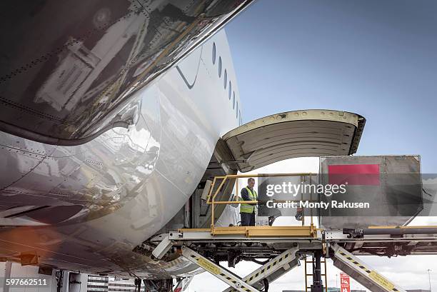 freight loader on a380 aircraft - container stock-fotos und bilder