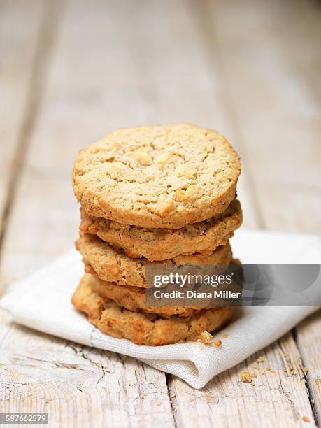 stack of apple crumble cookies on tea towel - apple crumble stock pictures, royalty-free photos & images