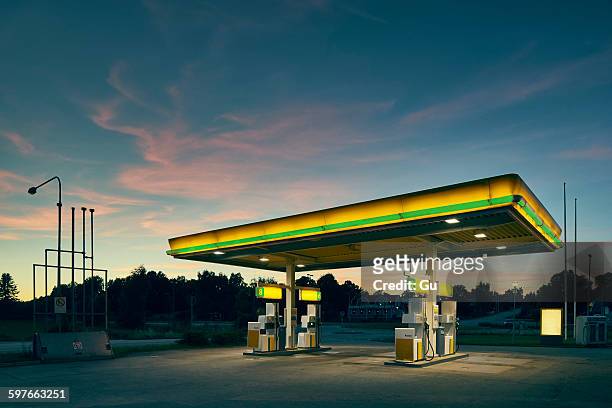 empty gas station at dusk, kalmar, sweden - gasoline station stock pictures, royalty-free photos & images