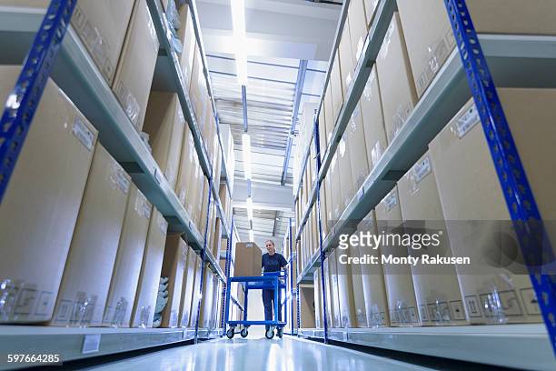 worker in warehouse of surgical instruments factory - 広角撮影 ストックフォトと画像