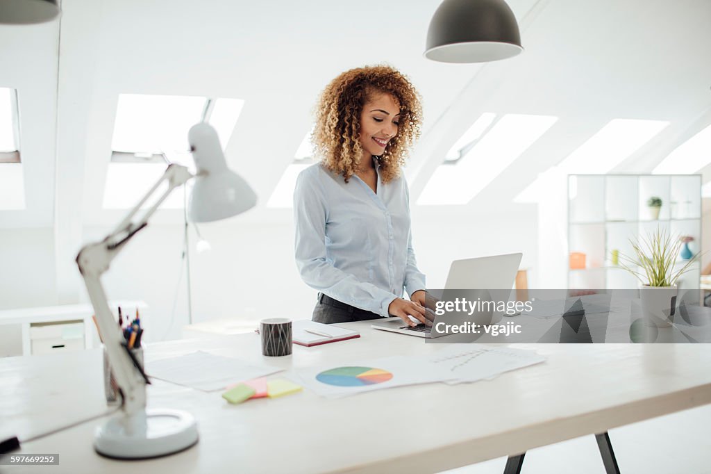 Latina Businesswoman Working In Her Office.