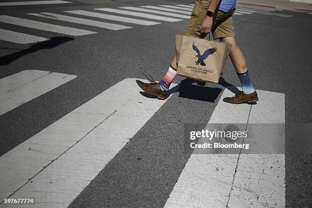 Pedestrian holds an American Eagle Outfitters Inc. Bag at the Easton Town Center shopping mall in Columbus, Ohio, U.S., on Tuesday, Aug. 23, 2016....