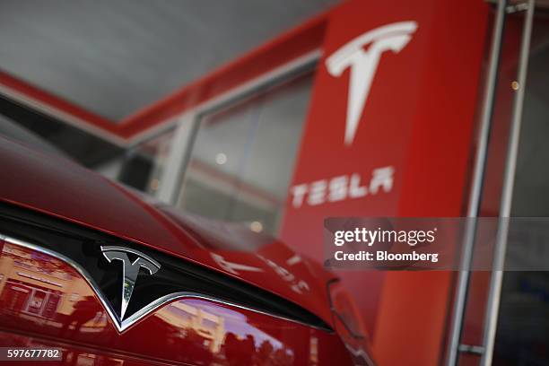 Tesla Motors Inc. Electric vehicle sits on display outside a company's store at the Easton Town Center shopping mall in Columbus, Ohio, U.S., on...