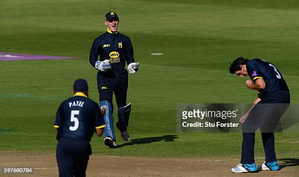 Warwickshire bowler Chris Wright (r0 celebrates after he had combined with substitute wicketkeeper Alex Mellor to dismiss Somerset batsman Tom Abell...