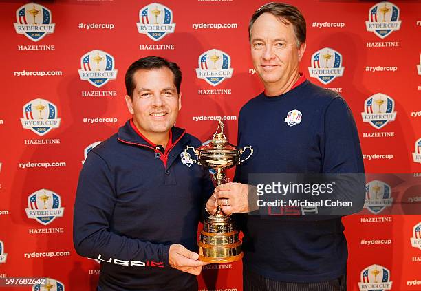 Derek Sprague, President of the PGA of America and Davis Love III United States Ryder Cup Captain pose with the Ryder Cup during a press conference...