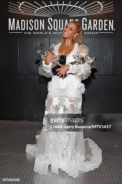 Beyonce poses backstage with her awards during the 2016 MTV Video Music Awards at Madison Square Garden on August 28, 2016 in New York City.