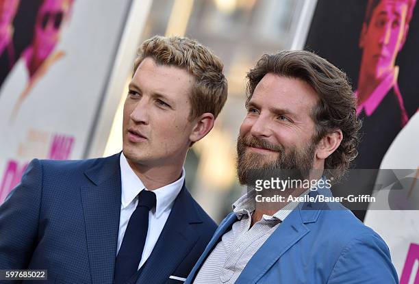 Actors Miles Teller and Bradley Cooper arrive at the premiere of Warner Bros. Pictures' 'War Dogs' at TCL Chinese Theatre on August 15, 2016 in...