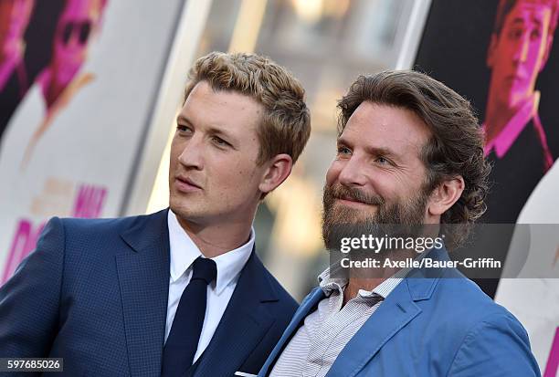 Actors Miles Teller and Bradley Cooper arrive at the premiere of Warner Bros. Pictures' 'War Dogs' at TCL Chinese Theatre on August 15, 2016 in...