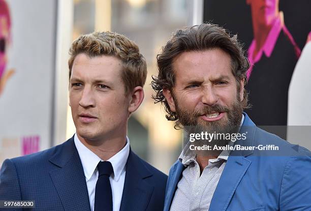 Actors Miles Teller and Bradley Cooper arrive at the premiere of Warner Bros. Pictures' 'War Dogs' at TCL Chinese Theatre on August 15, 2016 in...