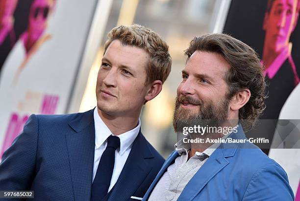 Actors Miles Teller and Bradley Cooper arrive at the premiere of Warner Bros. Pictures' 'War Dogs' at TCL Chinese Theatre on August 15, 2016 in...