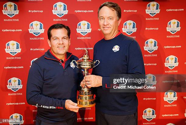 Derek Sprague, President of the PGA of America and Davis Love III United States Ryder Cup Captain pose with the Ryder Cup during a press conference...