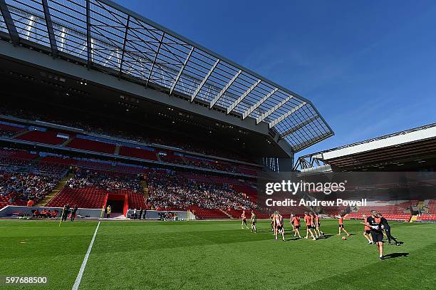 Fans of Liverpool wtach training at the main stand test event at Anfield on August 29, 2016 in Liverpool, England.