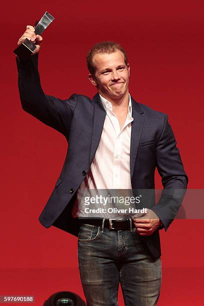 Fabian Hambuechen poses with the award for a picture at the Sport Bild Award 2016 at Fischauktionshalle on August 29, 2016 in Hamburg, Germany.