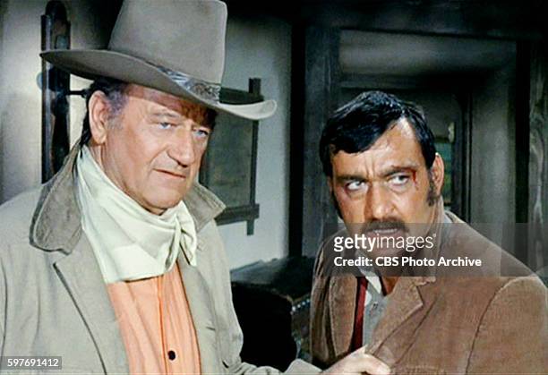 Theatrical movie originally released December 18, 1970. Film directed by Howard Hawks. Pictured left to right, John Wayne , and Victor French . Image...