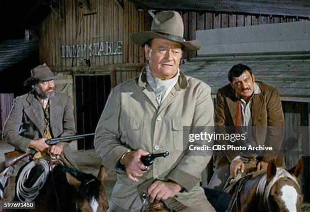 Theatrical movie originally released December 18, 1970. Film directed by Howard Hawks. Pictured left to right, Jack Elam , John Wayne , and Victor...