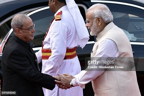 Indian Prime Minister Narendra Modi welcomes Indian President Pranab Mukherjee at President House during the ceremonial reception of Myanmar...