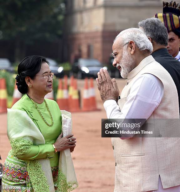 Myanmar's President's wife Su Su Lwin is received by Indian Prime Minister Narendra Modi during the ceremonial reception of Myanmar President U Htin...