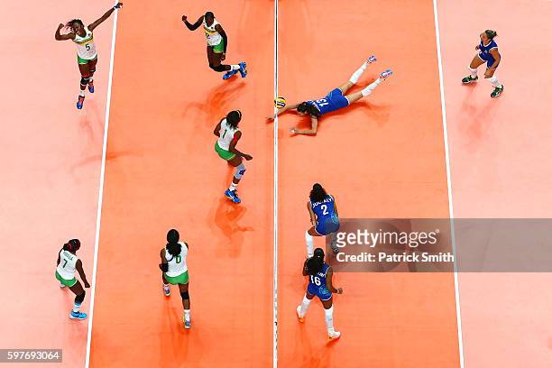 Theorine Christelle Aboa Mbeza of Cameroon celebrates a point as Sheilla Castro de Paula Blassioli of Brazil cannot get to the ball in time during...