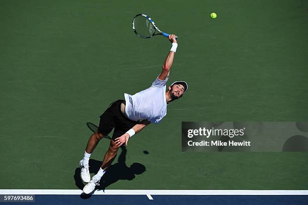 Jordan Thompson of Australia serves to Steve Darcis of Belgium during his first round Men's Singles match on Day One of the 2016 US Open at the USTA...