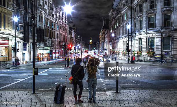young travellers in london at night - anatoleya stock pictures, royalty-free photos & images