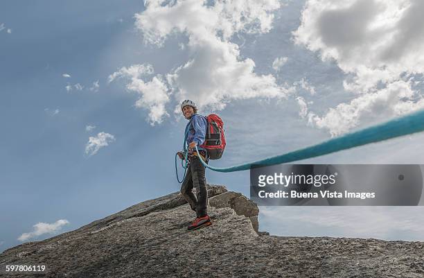 a climber with rope on a mountain top - haute savoie stockfoto's en -beelden