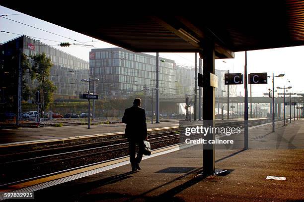 lonely passenger at lille flandres'station - lille france stock pictures, royalty-free photos & images