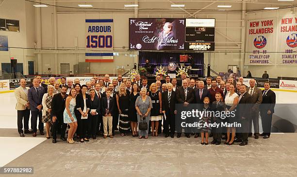 Family members of Al Arbour, guests, current and former Islanders players pose for a photo during the New York Islanders memorial service for Al...