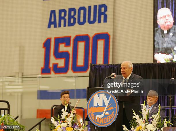 Senior VP of hockey operations Jim Gregory addresses the guests during the New York Islanders memorial service for Al Arbour on August 29, 2016 in...