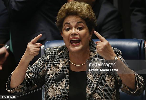 Suspended President Dilma Rousseff speaks while answering a question from a Senator on the Senate floor during her impeachment trial on August 29,...