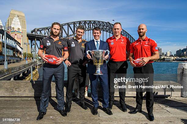 Callan Ward, Leon Cameron, Premier of NSW Mike Baird, John Longmire and Jarrad McVeigh pose for a photo with the 2016 AFL Premiership Cup during an...