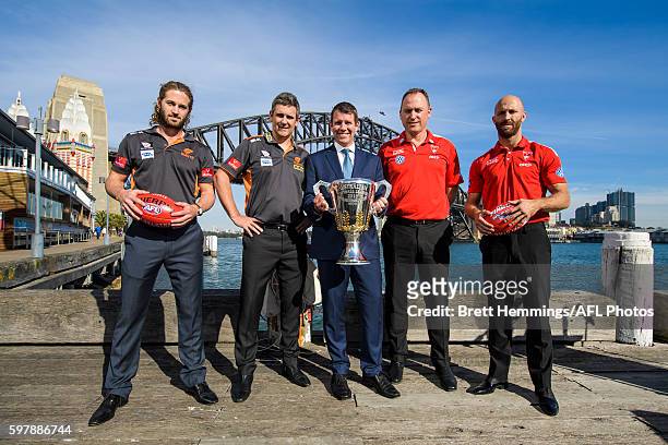 Callan Ward, Leon Cameron, Premier of NSW Mike Baird, John Longmire and Jarrad McVeigh pose for a photo with the 2016 AFL Premiership Cup during an...